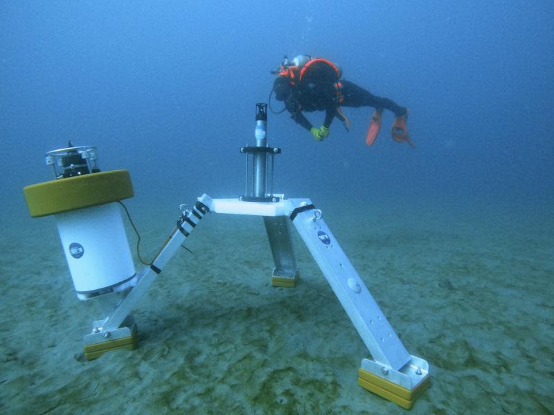 Hydrophone lander on the seafloor with a research diver nearby