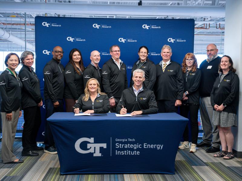 Pacific Northwest National Laboratory Director Deb Gracio (front left) and Georgia Institute of Technology Executive Vice President for Research Tim LIeuwen (front right) signed a memorandum of understanding between the two institutions.