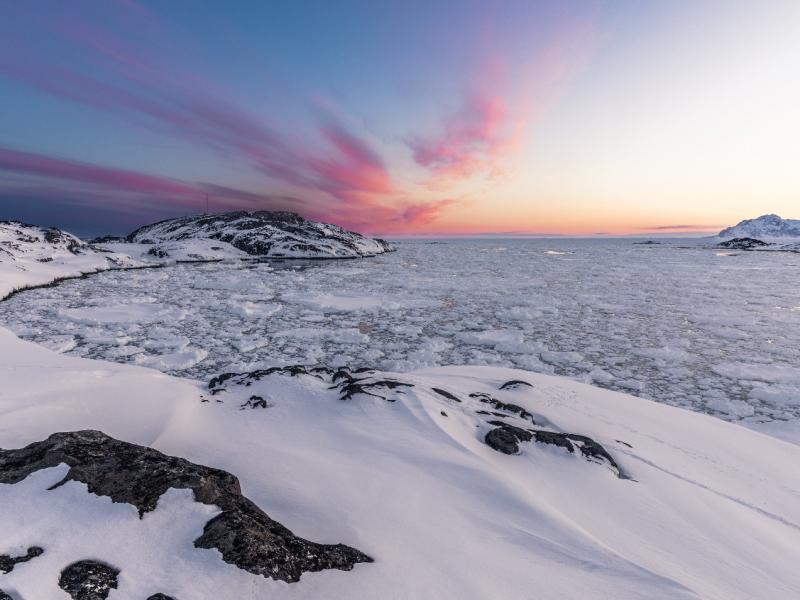 Image of snow covered shore and icy water