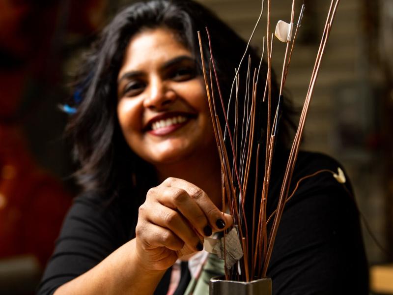 Smiling woman with wires