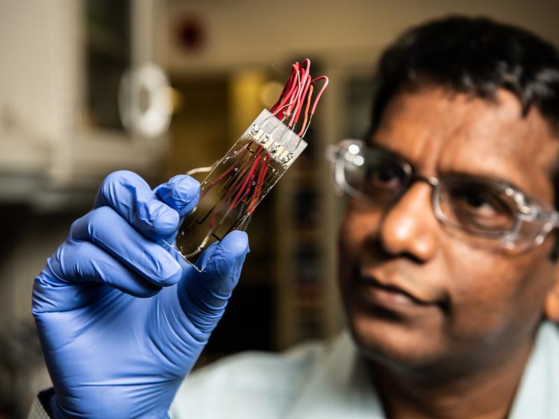 scientist examining sensor technology