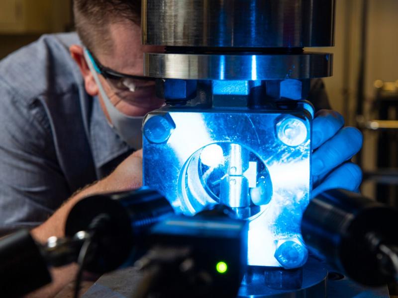 Researcher Robert Seffens works with the sight flow vessel
