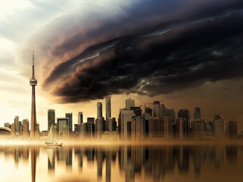 Artists rendering of storm clouds above a city skyline