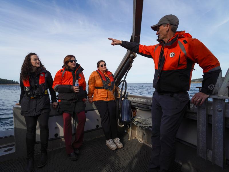 PNNL's Christian Meinig points out ongoing ocean science research to visitors at PNNL-Sequim.