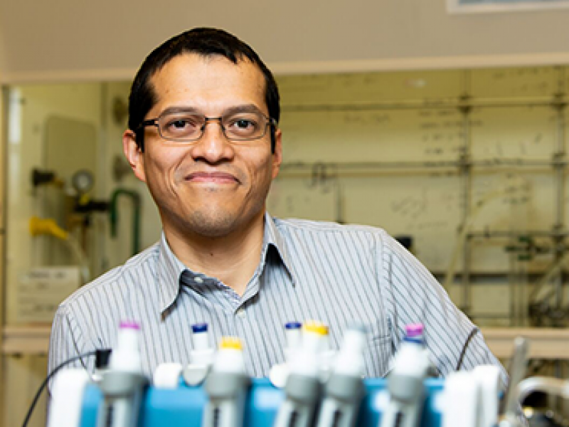 Chemical engineer Oliver Y. Gutiérrez poses in a laboratory in the Physical Sciences Laboratory building. 