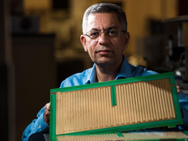 Yehia Ibrahim with the SLIM device