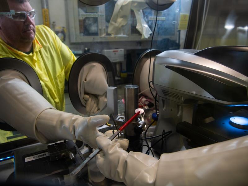 Scott Swenson of PNNL working in a hood system with nuclear materials 