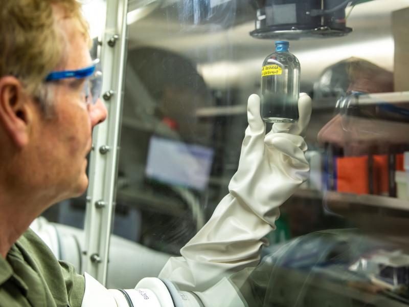Researcher holding material sample