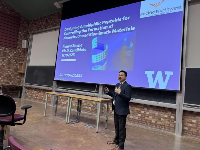 Renyu Zheng giving an award presentation