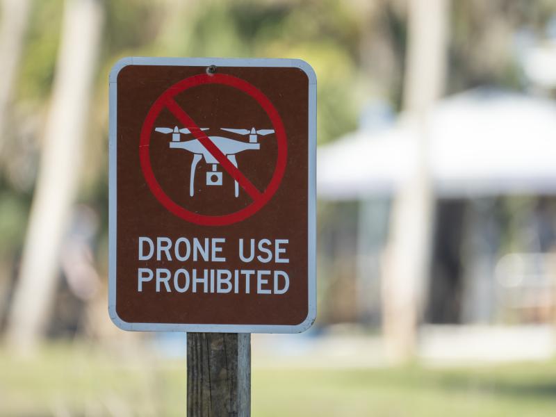 Red sign that says "drone use prohibited
