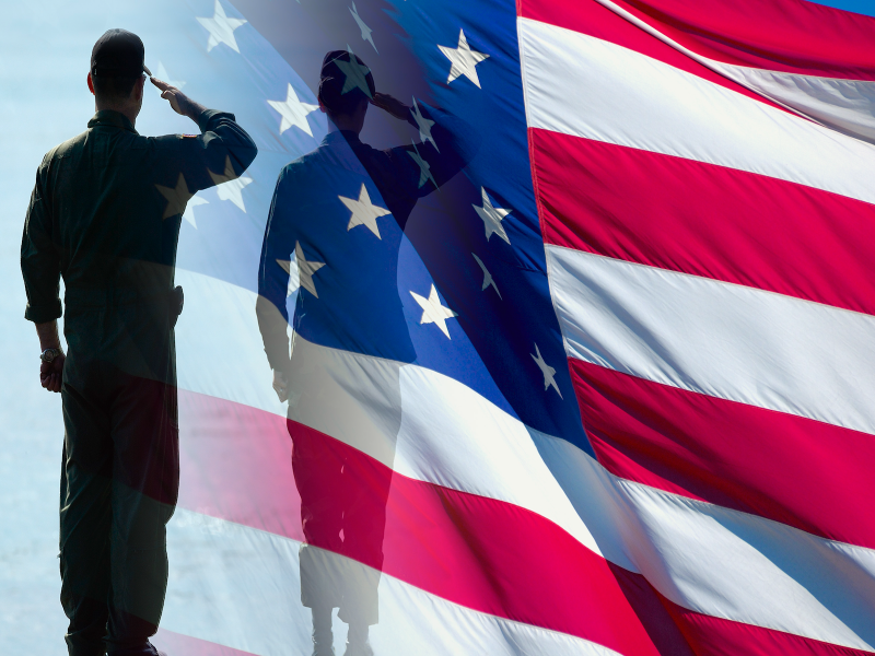 A soldier salutes the American flag