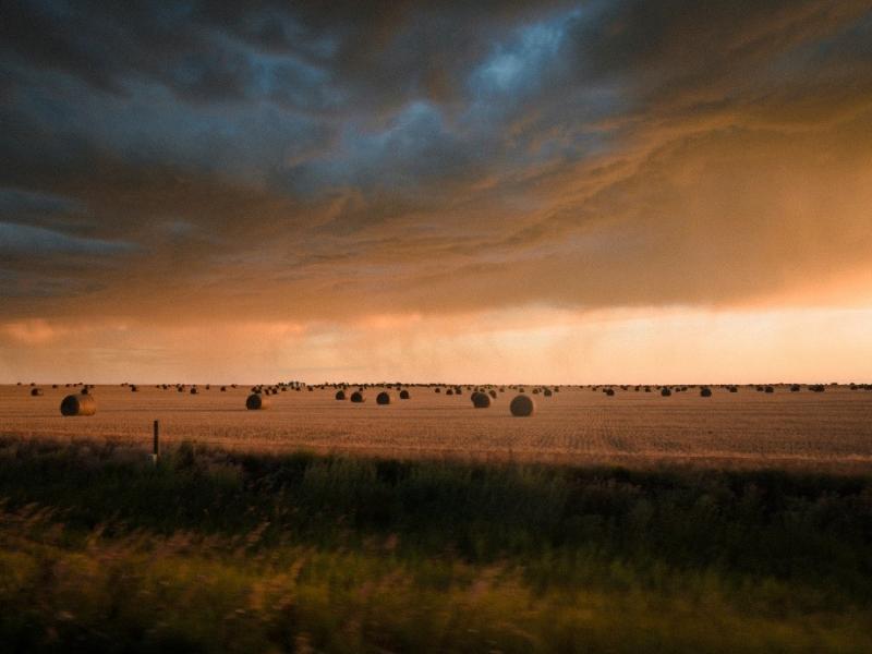 storm clouds over farm land
