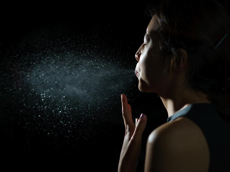 a woman exhaling